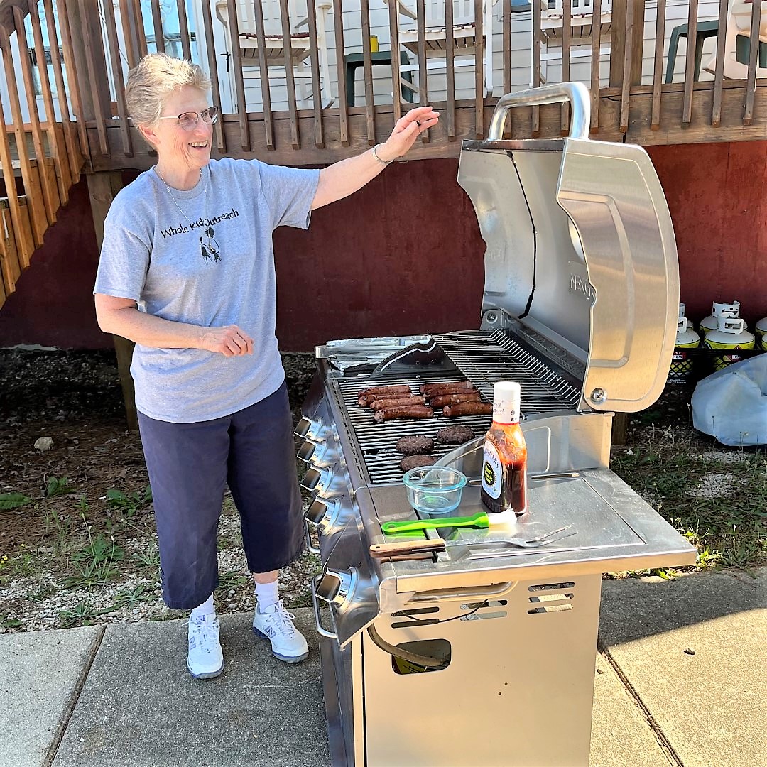 Sister Carol Jean Dust cooking on the BBQ grill.