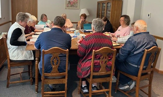 The Central Pacific Province’s Ministry Commission meets around a large table at Sancta Maria in St. Louis.