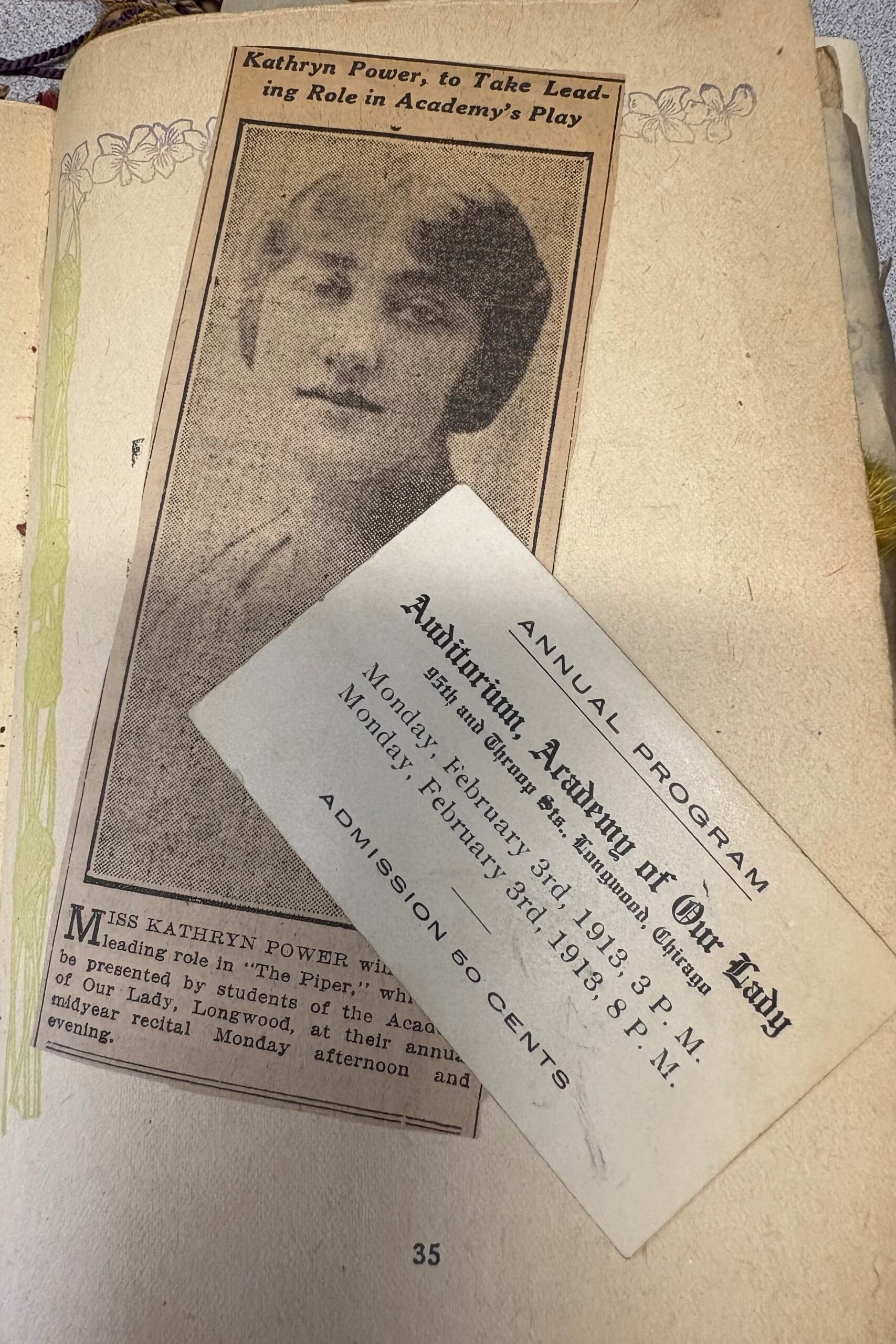 A scrapbook page shows an article about a production of "The Piper" staged by the students at AOL in February of 1913 as well as a ticket for the show. 