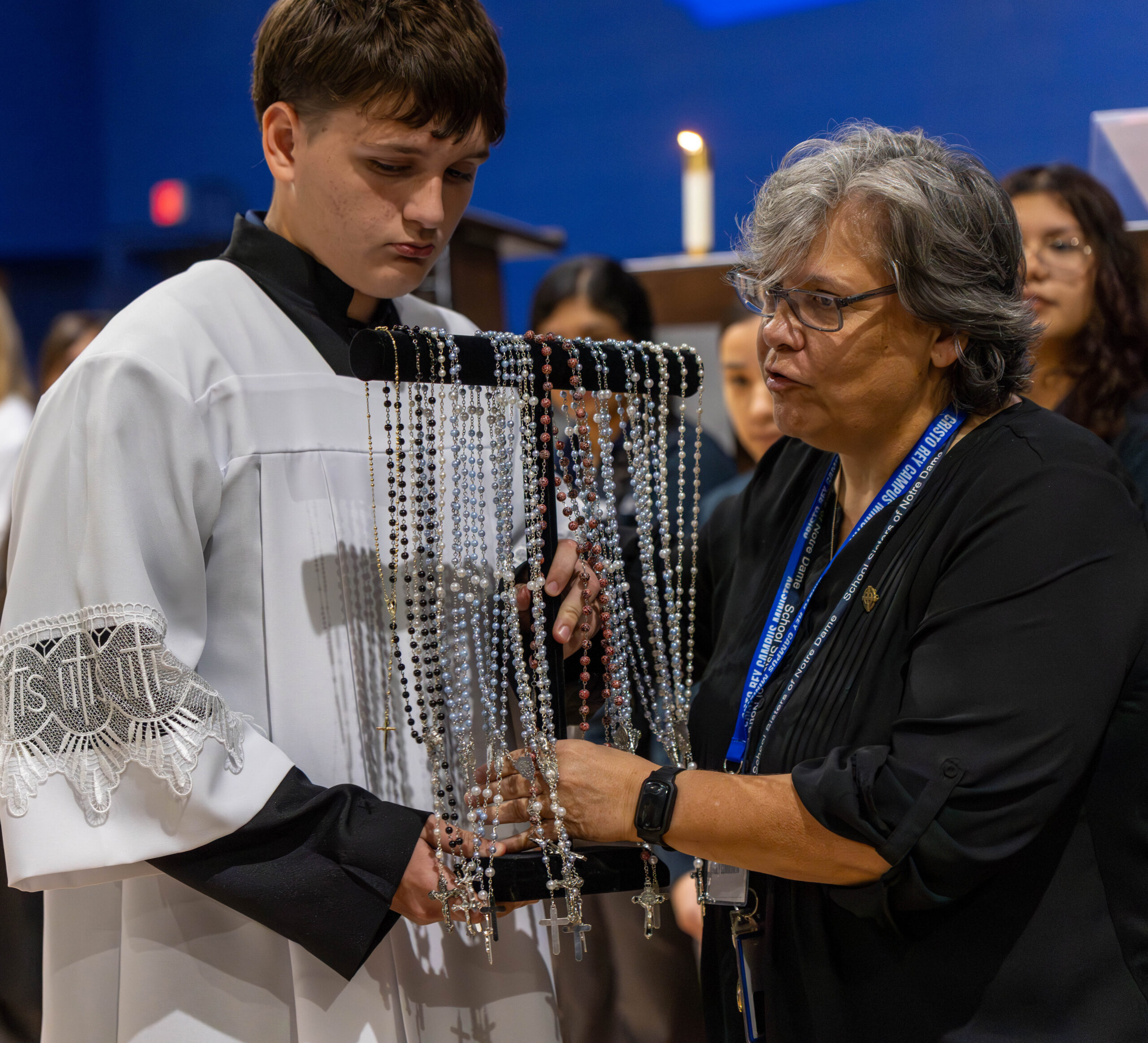 Sister Bridget and student from Cristo Rey Dallas with rosary beads.